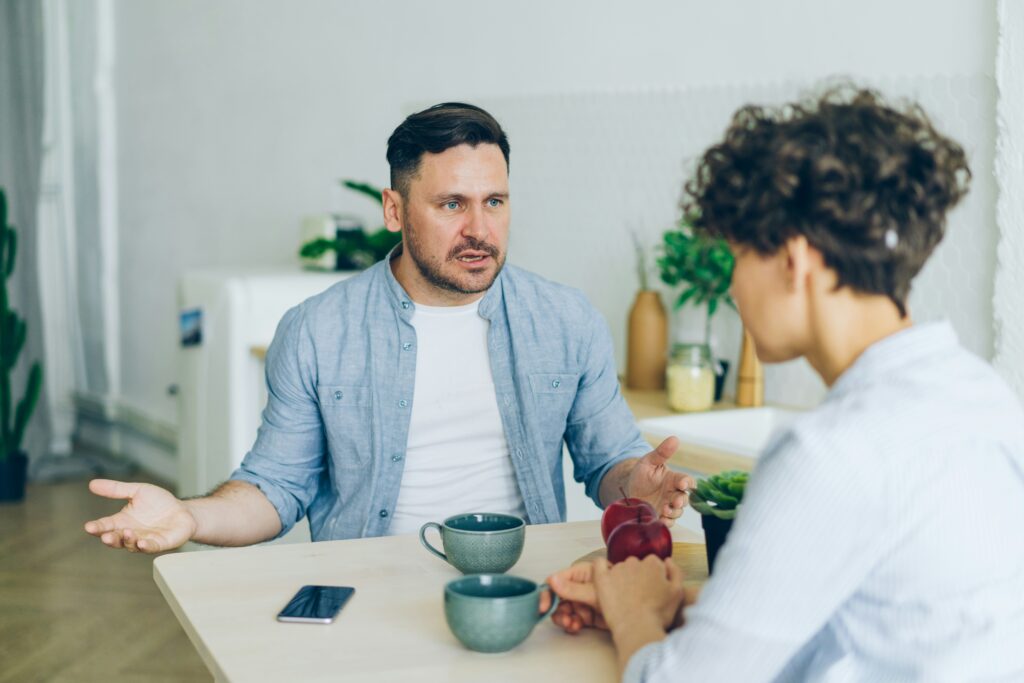 Man talking to a woman