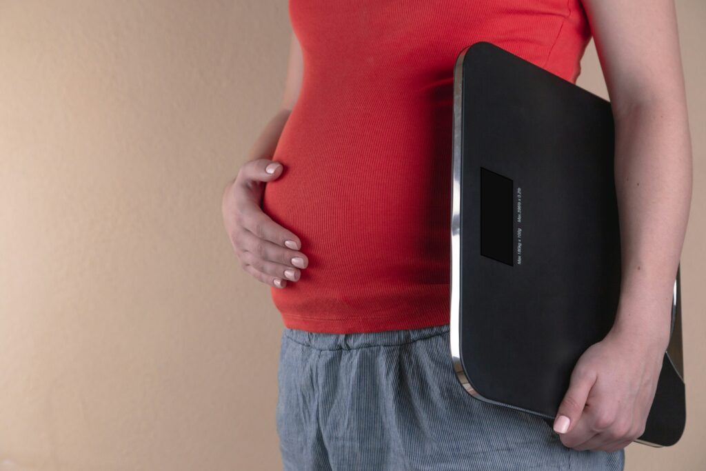 Person holding the scale